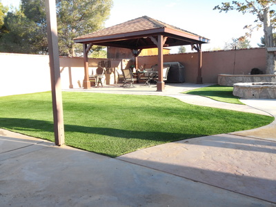 Stamped concrete, artificial grass and freestanding gazebo