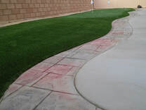 Stamped concrete border with putting green