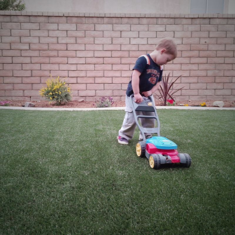 CUTE CHILD WITH TOY LAWN MOWER IN PALMDALE CA
