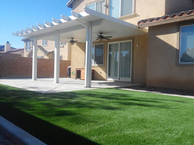 Aluminum patio cover with artificial grass lawn